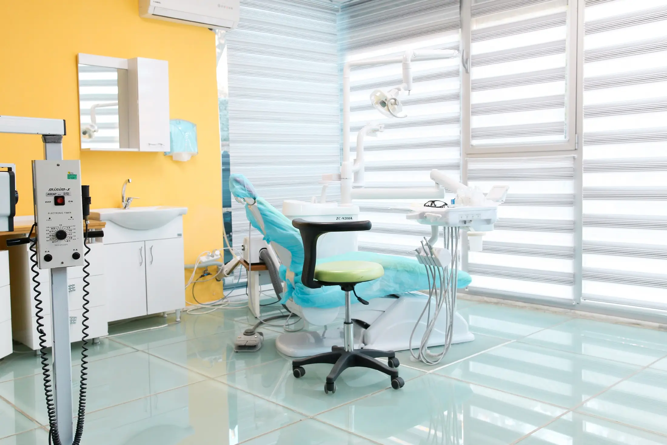 A treatment suite with the blinds drawn against the afternoon sun