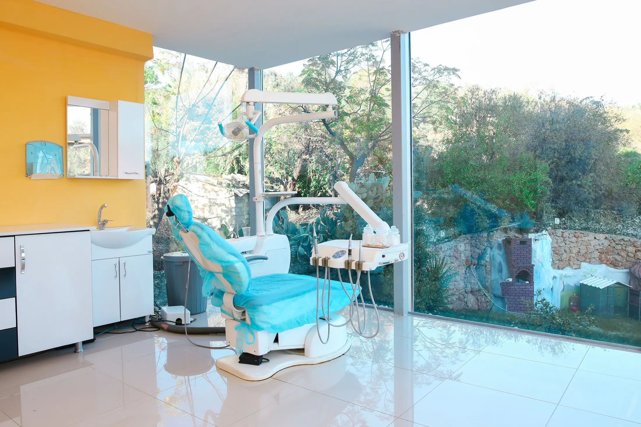 A treatment suite with a full-height window onto the garden